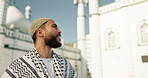 Muslim, religion and man by mosque for faith, religious learning and prayer for Eid Mubarak. Islamic community, Saudi Arabia and person by holy temple for Ramadan Kareem, worship and belief in city