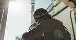 Muslim, religion and people hug by mosque for community, hello and greet Islamic friends. Worship, prayer and men by religious building for Ramadan Kareem, Eid Mubarak and praying in Saudi Arabia