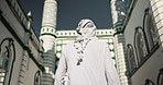 Muslim, religion and man by mosque walking for worship, religious education and prayer for Eid Mubarak. Islam city, Saudi Arabia and back of person by holy temple for Ramadan Kareem, faith and belief