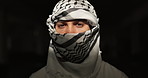 Muslim, religion or face of man with keffiyeh scarf for Palestine resistance, peace or religion solidarity on black background. Portrait, Islamic person or printed fabric for strength or perseverance