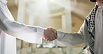 Islamic, muslim and men with handshake in mosque for greeting, respect and support in arabic community. Friends, people and shaking hands in place of worship for prayer, peace and religious belief