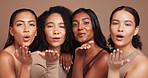 Women, face and blow kiss in studio for skincare with diversity, natural makeup and beauty with wellness of routine. Female people, inclusion and happy with pride for equality, dermatology and shine.