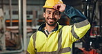 Helmet, worker and laughing of man in construction, safety and industry of engineering, face and building. Industrial, happy and portrait of person, smile and joy of employee in factory and warehouse