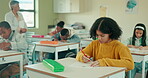 Exam, writing and students in classroom for group, test and knowledge in elementary school. Education, childhood development and desk for assessment, teacher and learning for young people in academy 