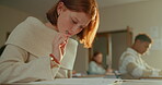 Student, girl and thinking in classroom for writing test, assessment and concentration for answer or question. Learner, high school and education for knowledge, examination and thoughts for quiz.