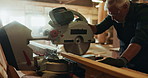 Mature man, circular saw and craft for construction, building or project for material, timber or supplies. Male person, woodcutter and manufacturing for contractor, warehouse or carpentry in workshop