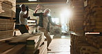 People, dancing and celebrate in woodwork factory, happiness with high five for business success. Manager, employee and together with excited movement for job, teamwork and collaboration in warehouse
