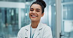 Doctor, woman and smile with face in hospital for healthcare, wellness and medical work. Professional, laughing and portrait with confidence of surgeon in a neurology clinic with happy employee