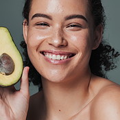 Woman, Avocado And Studio Background With Smile For Beauty Or Skincare 