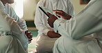 Hands, tablet and teaching with Islamic people reading Quran online together in Mosque for faith. Belief, religion or scripture and students learning with Mullah for Muslim culture or tradition