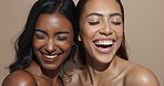 Face, women and laughing for beauty, skincare or wellness with multicultural, inclusion for cosmetics. Female people, healthy skin and happy with eyes closed, glow in dermatology in studio background