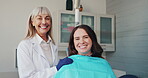 Dentist, happy and patient in chair at dentist with support for healthcare, teeth whitening and dental service. Woman, face and consultation in clinic at orthodontist for veneers and tooth extraction