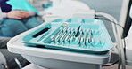 Dentist, tools and tray or closeup in consultation with choice for healthcare procedure or health clinic. Oral hygiene, dental person and working with mirror, excavator or orthodontic equipment