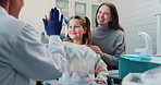 Girl, kid and happy with high five for dentist for success of treatment, friendly and build trust for procedure. Pediatric, young patient and hand gesture for well done, good behavior and celebration