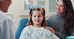 Kid, dentist and woman in office for consultation for tonsil symptoms, cavity bacteria and gum infection of checkup. Smile, girl and orthodontist with mother for tooth extraction, talk and wellness