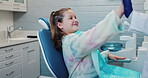 High five, dentist and girl on chair, smile and child in appointment for checkup, cavity and healthcare. Clinic, happy and kid with pediatrician for exam of growth of teeth, vaccine or dental health