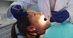 Oral care, teeth and dentist with child patient in office for appointment, checkup or examination. Healthcare, medical or mouth with orthodontist and girl client in chair for consultation or visit