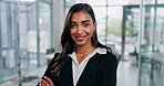 Portrait, confidence and Indian business woman in office for pride, career or corporate job. Face, arms crossed and happy professional entrepreneur, employee or insurance agent in suit at company