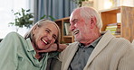 Senior, happy couple and laughing with funny memory, joke or humor in reminisce at home. Elderly man, woman or old lovers with smile in relax on sofa for bonding, love or fun communication at house