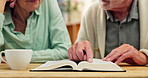 Home, hands and senior couple with bible, religion and communication for scripture, teaching and guidance. Closeup, mature man and old woman with holy book, spiritual bonding and faith with belief