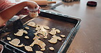 Cookies, hands and baking with child for dessert, food and family in kitchen with recipe. Snack, decorations or childhood development for young person, sprinkles or cooking with ingredient with dough