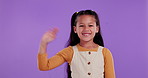 Happy girl, child and wave with greeting in studio for introduction, hello or bye on a purple background. Portrait of female person, friendly little kid or smile for presentation, signal or gesture