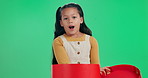 Little girl, gift and christmas with red box on green screen in surprise, studio or background. Young female person, child or kid in wow or December for present, parcel or package on festive season