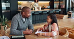 Father, girl and book for teaching in home, education and helping with homework or school project. Daddy, daughter and studying for test or assignment, support and speaking on lesson for knowledge