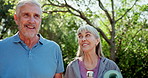 Senior couple, yoga mat and walk park on grass with conversation, memory or joke in summer. Retirement, woman and man on path in backyard at house for health, wellness and chat with water in Canada