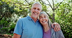 Senior couple, face and smile in park with hug for care, love or summer with connection in retirement. People, man and woman with embrace, happy and outdoor for portrait, sunshine or nature in Madrid