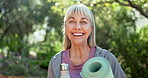 Senior woman, yoga mat and face in park with smile, bottle and outdoor to start morning with exercise. Person, water and happy with by tress for portrait in summer sunshine for wellness in Florida