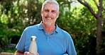 Senior man, yoga mat and face in park with smile, bottle or outdoor to start morning with exercise. Person, water and happy with by trees for portrait, sunshine or retirement with wellness in Florida