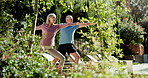 Senior couple, yoga and morning in garden with warrior two for muscle, health or stretching in summer. Man, woman and retirement with wellness by trees with bonding, connection or love in Los Angeles