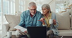 Laptop, documents and senior couple on a sofa with love, planning and checking budget, savings or pension fund at home. Retirement, tax or old people online in living room with investment application