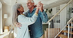 Happy, dancing and senior couple holding hands in living room for love, relationship or hug. Smile, married man and elderly woman with retirement for movement, care or bonding together in home  