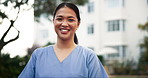 Nurse, face and outdoor with smile at hospital, garden and career in healthcare with pride in summer. Person, happy and portrait for medical services, wellness and confident at clinic in Indonesia