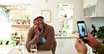 Senior man, couple and taking photo in kitchen for social media and profile picture update with smile. Happy, retirement and new house with excited grandpa with wine and memory for anniversary