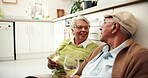 Happy, senior couple and kitchen with wine glass for bonding, care and support. People, family and smile with love at home on floor with alcohol on retirement, pensioner and relationship with love