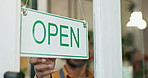 Open, cafe and small business of entrepreneur, sign and closeup of door, hand and startup of retail. Morning, person and owner of coffee shop, industry and barista in hospitality, loan and entrance