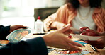 Woman, arts and crafts in home on table, color swatches and mood board with images for fun activity together. Creative people, brainstorming and group ideas for visual inspiration, weekend and break