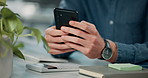 Businessman, hands and typing on cellphone at desk for research and networking in office. Online, chat and notification for mobile app with journalist in workplace for telemarketing and website  