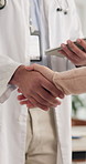 Doctor, handshake and patient with tablet in hospital for healthcare, greeting and consulting welcome of test results. People, introduction and digital for support, advice and information of wellness