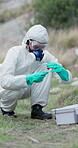 CSI, evidence and investigation with hazmat person outdoor in field to collect sample for study. Crime scene, forensics or search and investigator with equipment for analysis in forest or woods