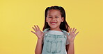 Young girl, face and happy in dungaree on studio background for playful, innocent and fashion. Child, portrait and smile in casual, comfortable and denim clothes with excitement for back to school