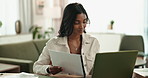 Laptop, Indian woman and home for online, note or paperwork for remote work from living room. Lounge, checklist or internet for language transcriber, technology or website for freelance female person