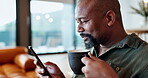 Coffee, phone or mature black man on social media for election choice or website notification in home. Drinking beverage, search or person texting on networking mobile app or reading news to relax