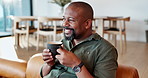 Aroma, coffee and smile with mature man on sofa in living room of home for thinking or wellness. Contemplating, relax and scent with happy African person in apartment for break or weekend time off