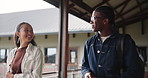 People, university and talking with handshake for education, greeting or learning for knowledge of study in hallway. Smile, man and woman as students with conversation, walking and future development