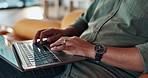 Remote work from home, hands and man with computer, typing and connection with internet, research and mail. Closeup, keyboard or person on sofa, laptop and tech with website for instruction or review