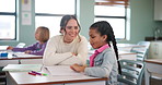 Teacher, woman and help kid for education, studying or writing knowledge in book at class. Child, happy educator and student learning in lesson for development, teaching and support in kindergarten